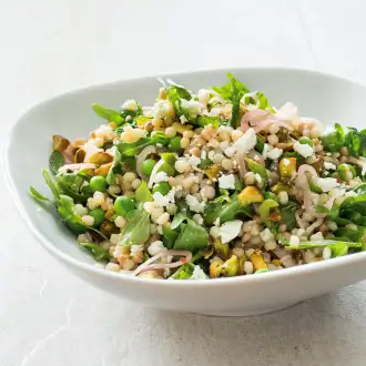 Israeli couscous salad with lemon, mint, peas, feta, and pickled shallots