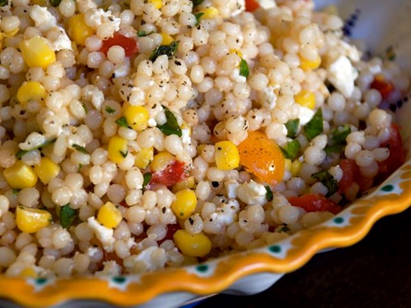 Israeli couscous with fresh corn, tomatoes, and feta