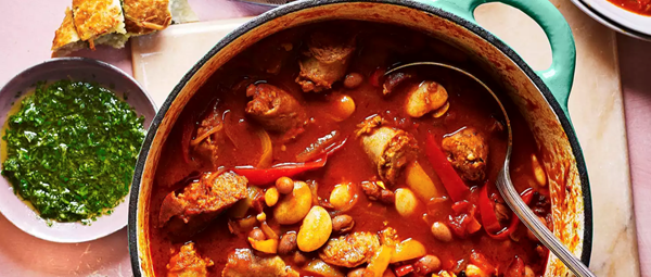 Italian sausage casserole with cheesy garlic bread and gremolata