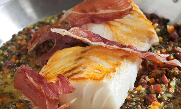 J Sheekey’s cod with braised lentils and prosciutto by Tim Hughes 