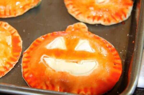 Jack-o-lantern spinach stuffed pastries