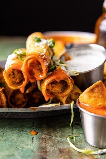Jalapeño cream cheese chicken taquitos with Buffalo sauce