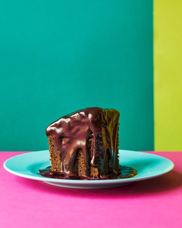 Jamaican ginger cake with chocolate ganache and berry coulis 