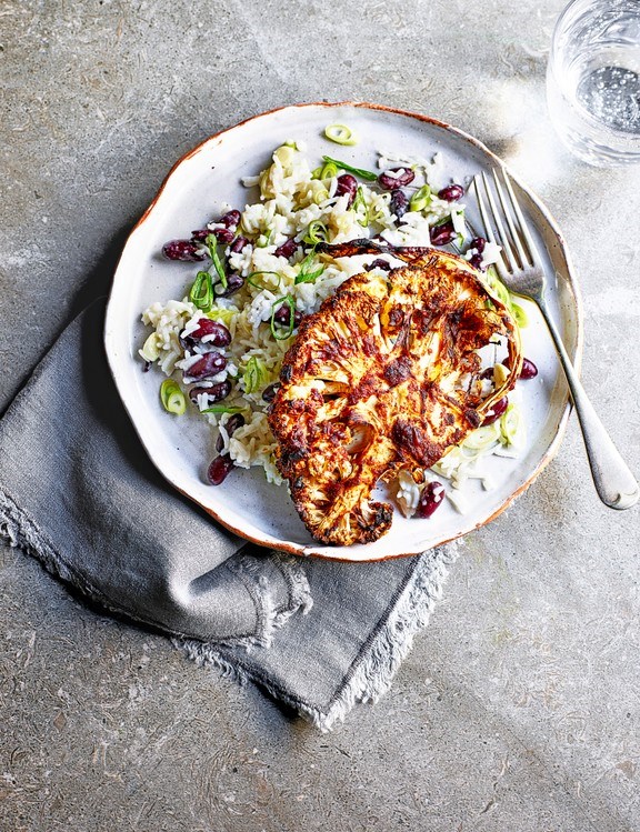 Jerk cauliflower steaks with rice and peas