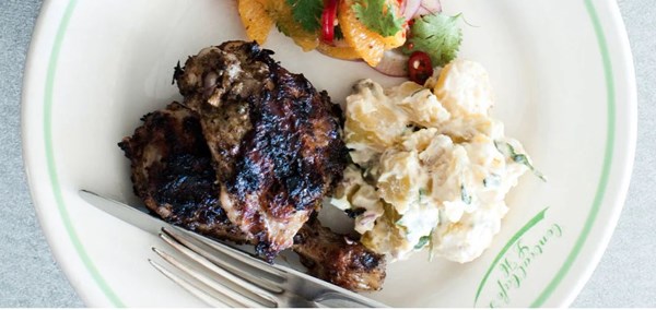 Jerk chicken with kumara salad and orange and red onion salsa