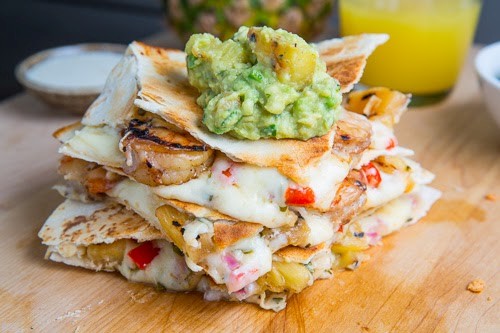 Jerk shrimp and pineapple salsa quesadillas with pina colada guacamole