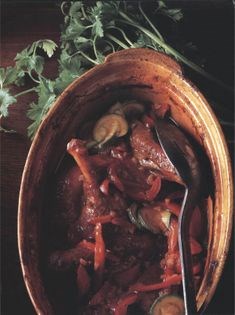 Joints of duck with saffron, red peppers and courgettes