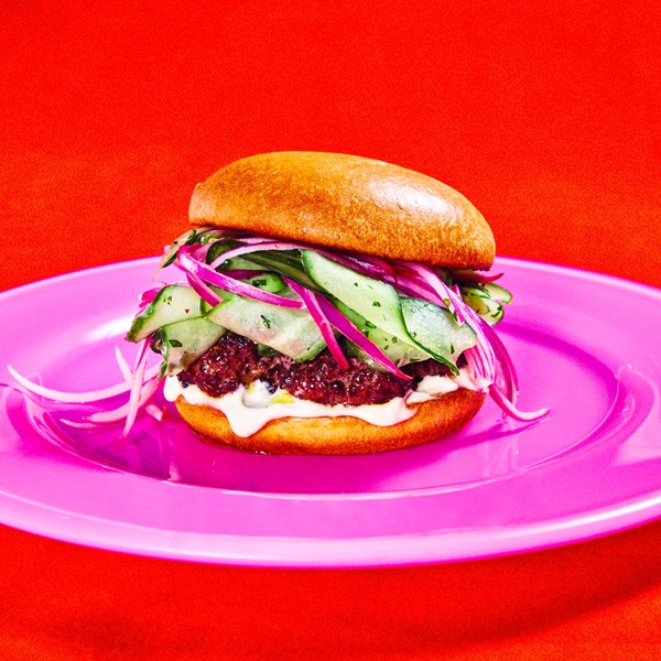 Juicy bison burger with cucumber-red onion slaw