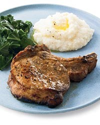Juicy buttermilk pork chops with turnip greens and herbed grit cakes