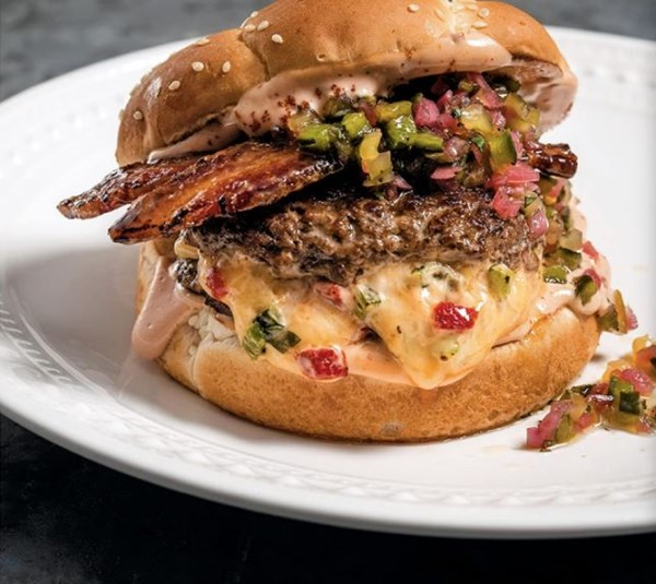 Juicy Lucy cheeseburgers with black pepper-honey glazed bacon and smoked chile special sauce