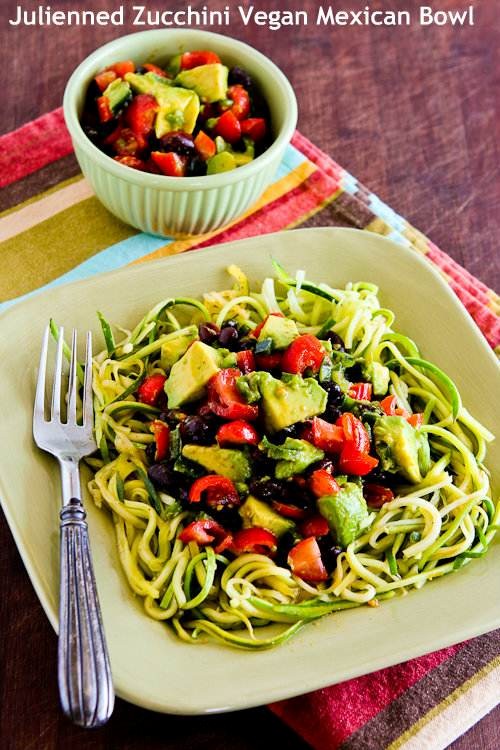 Julienned zucchini vegan Mexican bowl with black beans, avocado, tomato, poblano, and lime