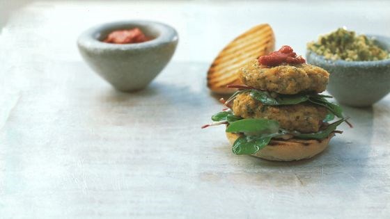 Jumbo prawn burger with North African spices, tomato chermoula, and olive couscous salad