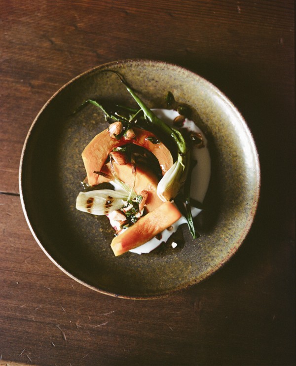 Kabocha squash and grilled new onion salad with yogurt, pomegranate, and almonds