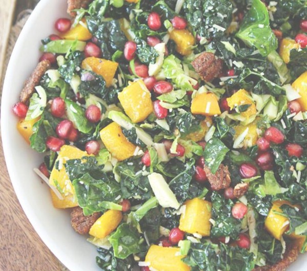 Kale and Brussels sprouts salad with butternut squash, pomegranate, and candied pecans