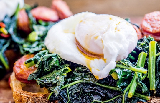 Kale and chorizo on toast with poached egg