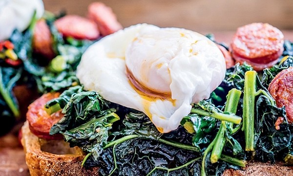 Kale and chorizo on toast with poached egg