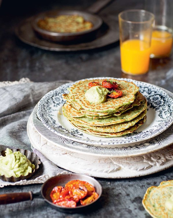 Kale and coriander pancakes with slow-roasted tomatoes and avocado cream