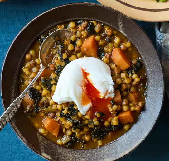 Kale and sweet potato with pasta and poached eggs
