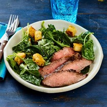 Kale Caesar salad with grilled steak