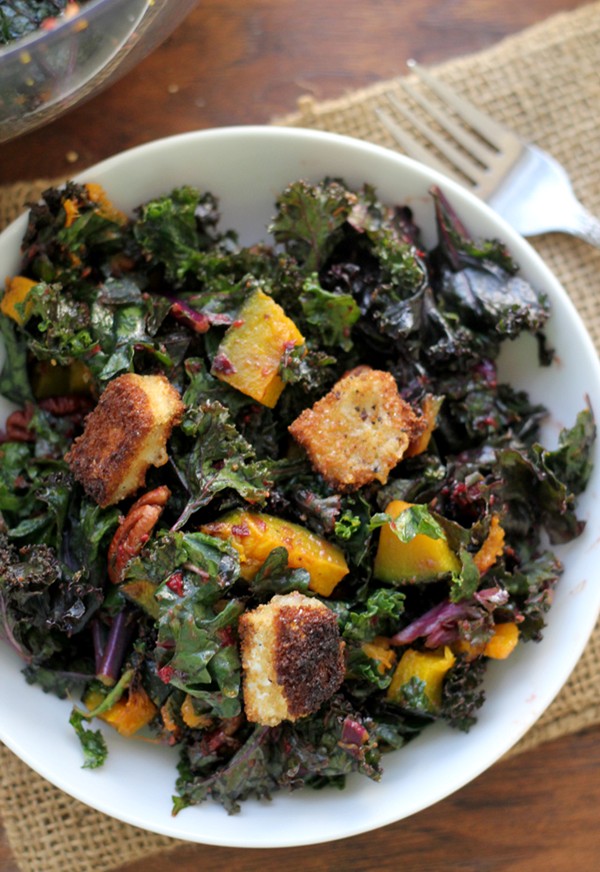 Kale salad with Brie croutons, roasted butternut squash, cumin-spiced pecans and a cranberry vinaigrette