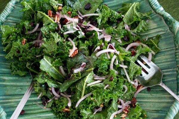 Kale salad with pecans and preserved berries dressing