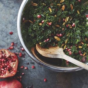 Kale salad with pomegranate and pumpkin seeds