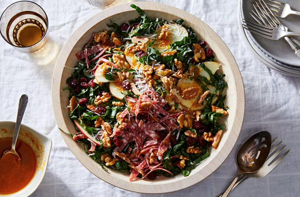 Kale salad with salami, pecorino, and walnuts