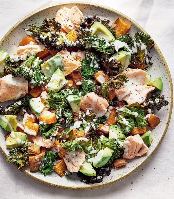 Kale, salmon + sweet potato salad with a creamy garlic dressing