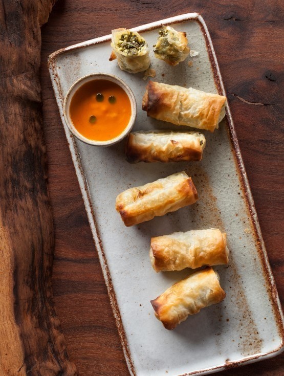 Kale spanakopita with harissa sauce and mint oil