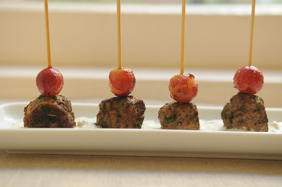 Kefta-style meatballs with grilled grapes and yogurt sauce