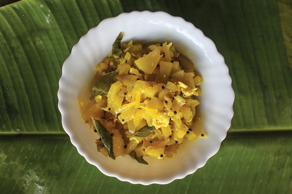 Keralan-style stir-fried green papaya (Papaya thoran)