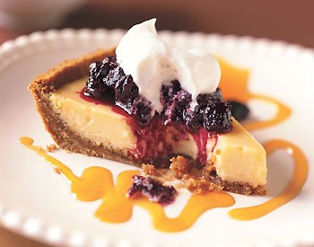 Key lime pie with passion fruit coulis and huckleberry compote