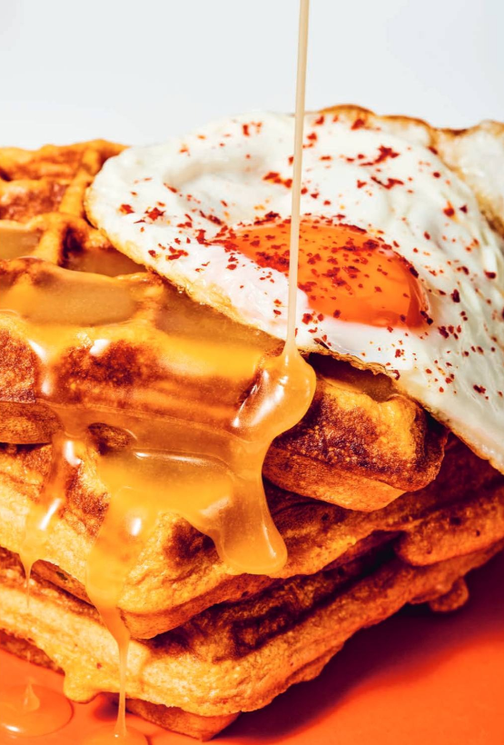 Kimchi cornbread waffles with honey butter and fried eggs