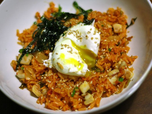 Kimchi fried rice with sautéed squid and a poached egg