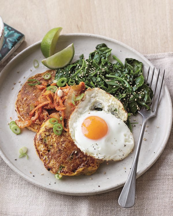 Kimchi potato pancakes with fried eggs and sesame spinach