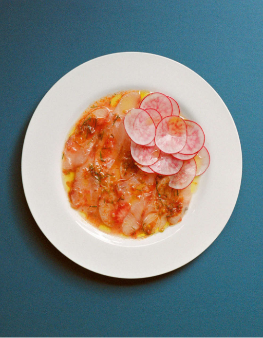 Kingfish crudo with a nduja and tomato dressing