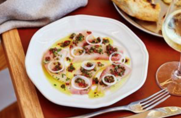 Kingfish crudo with Taggiasca olives, baby capers and spring onion