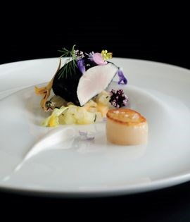 Kingfish marinated in squid ink with perfumed fruit and coconut