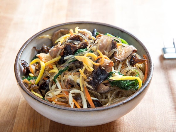 Korean glass noodles with pork and vegetables (Japchae)