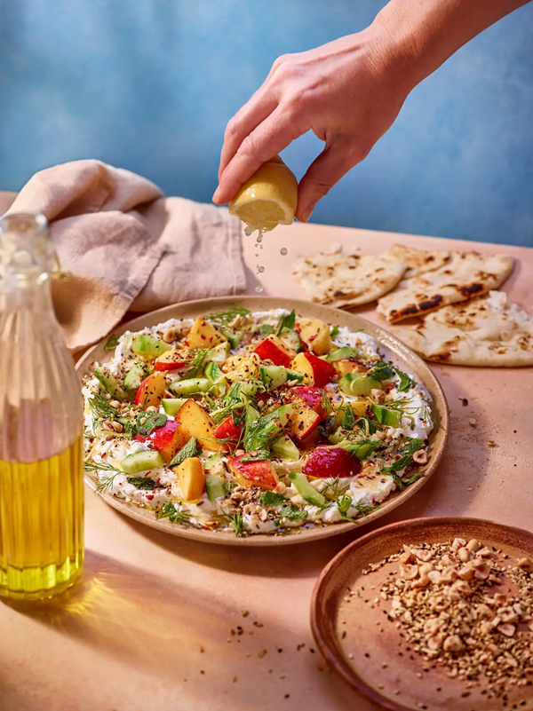 Labneh, nectarine and cucumber salad with hazelnut dukkah and herbs