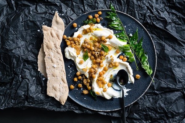 Labneh with fried chickpeas in garlic butter