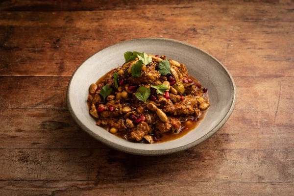 Lamb and mushroom stew with preserved lemon, olives and spiced almond crunch