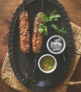 Lamb and quinoa kofte with anchovy and olive dressing and cucumber sumac yoghurt