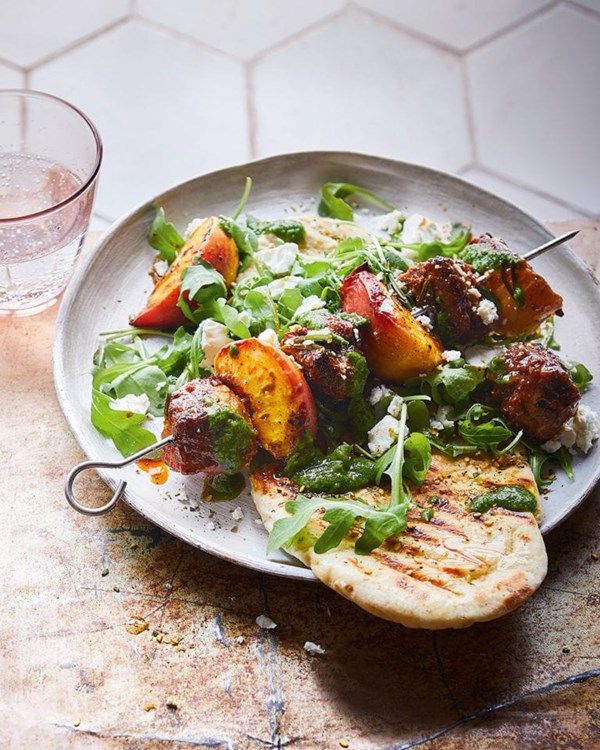 Lamb and stone fruit skewers with za'atar flatbreads and herby green sauce
