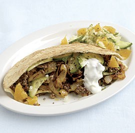 Lamb and sweet onion pitas with orange-cucumber salad