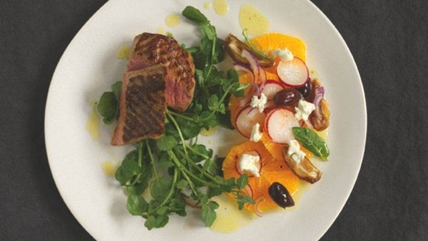 Lamb backstrap with orange, mint and date salad