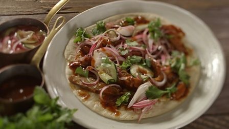 Lamb belly with BBQ sauce and pickled red onions