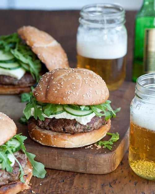 Lamb burger with arugula, feta and cucumbers