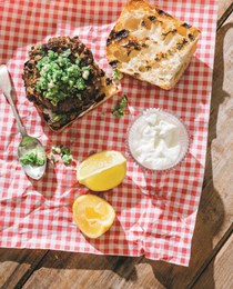 Lamb burgers with favas, peas, feta, and mint