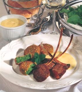 Lamb cutlets with pea fritters and garlic cream sauce